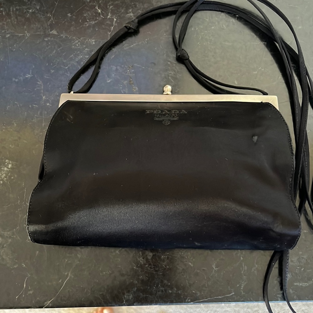 Prada iconic satin evening bag long shoulder strap, a celebrity favorite